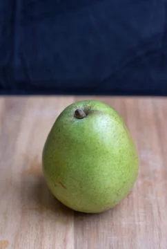 Pear on cutting board Stock Photos