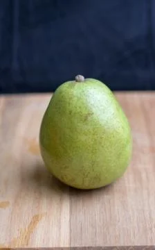 Pear on cutting board Stock Photos