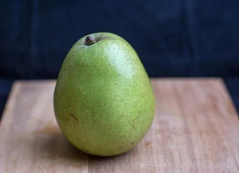 Pear on cutting board Stock Photos