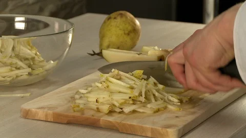 Pear cutting on a board video Stock Footage 122695700
