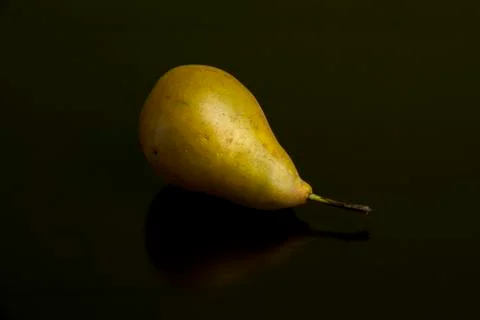Pear on dark background Stock Photos