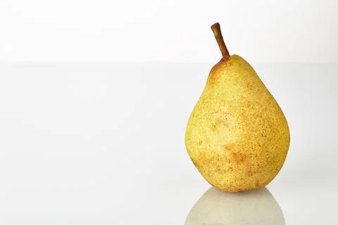 Pear fruit isolated on the white background. Single fresh juicy yellow-green Stock Photos