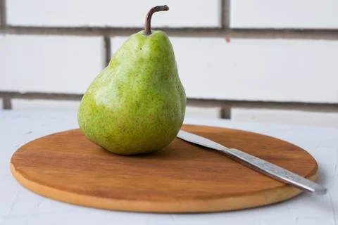 Pear on the green background Stock Photos
