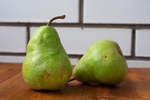 Pear on the green background Stock Photos