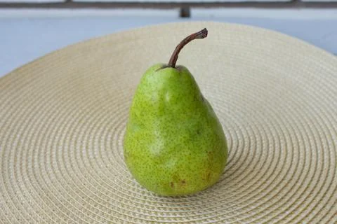 Pear on the green background Stock Photos