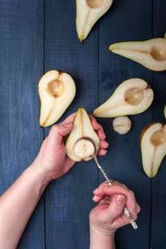 The pear halves with spoon on table Stock Photos