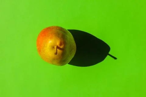 Pear with a hard shadow on a plain background. the view from the top. blank for 스톡 사진