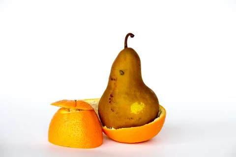 Pear inside an orange Stock Photos