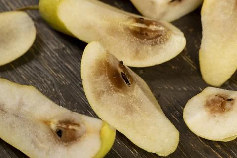 Pear inside of which has begun to rot, part of the rotted inside of a ripe .. Stock Photos