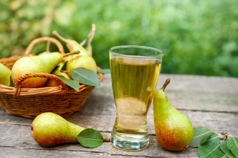Pear juice.Glass with pear juice. Stock Photos