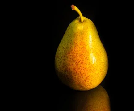 Pear lying on the table Stock Photos