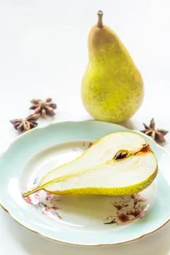Pear on a plate, light background Stock Photos