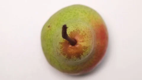 Pear rotating on white background. Macro close-up. Stock Footage 127573820