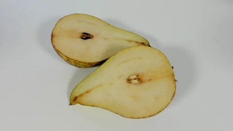Pear rotting on the table, after cutting Stock Footage 90354181