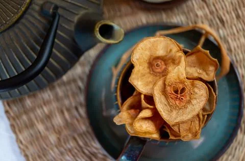 Pear thin chips are prepared for a hot drink with spices and cinnamon. Autumn Stock Photos