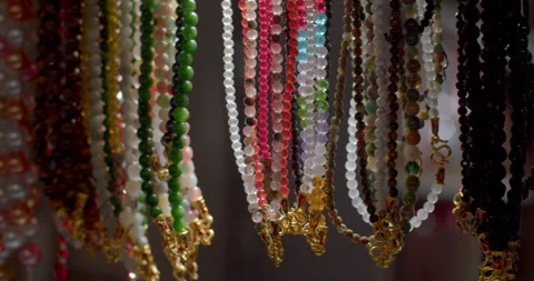 Pearl necklaces with various patterns.Pearl necklaces are popular as souvenirs. Stock Footage 304087228