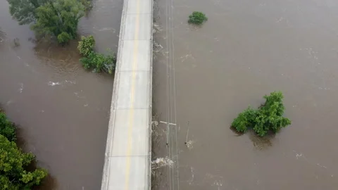 Pearl River rushing under bridge during Jackson MS Flooding Stock Footage 205897835
