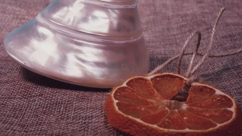 Pearl shell and dried orange slice close-up Stock Footage 101343262