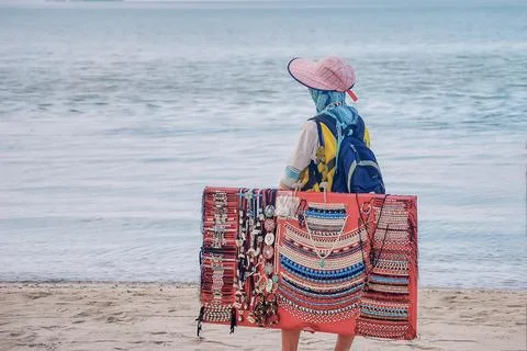 Pearl trader on the beach. Stock Photos