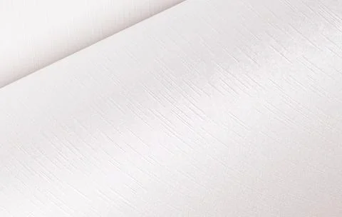 Pearl white paper texture with a subtle satin finish and soft wavy patterns.. Stock Photos