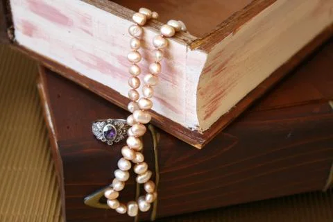 Pearls and a ring Stock Photos