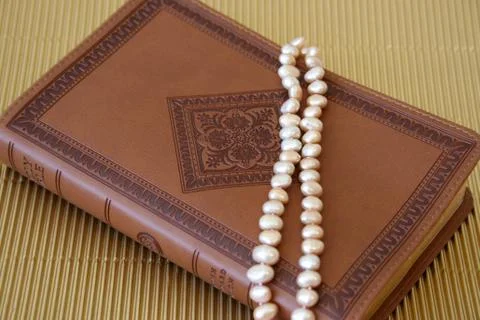 Pearls on leather Stock Photos
