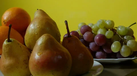 Pears and grapes, close up, dolly shot, fresh fruits on table. Stock Footage 60633539