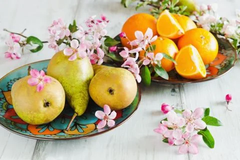Pears and oranges Stock Photos