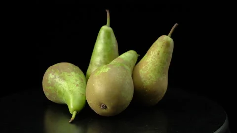 Pears on a black background close-up. Video stock 147678379