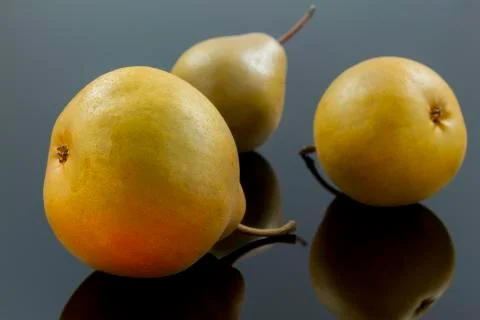 Pears on black Stock Photos
