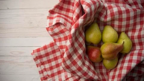 Pears on a checkered fabric Stock Photos