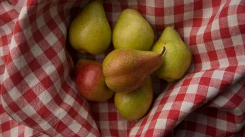 Pears on a checkered fabric Stock Photos