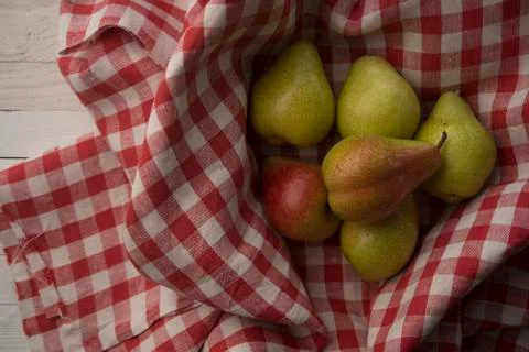 Pears on a checkered fabric Stock Photos