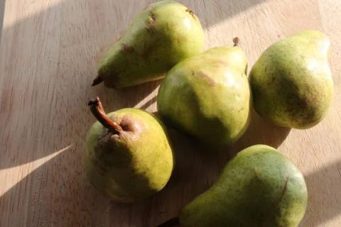 Pears on a chopping board Stock Photos