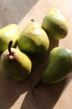 Pears on a chopping board Stock Photos