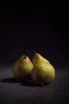 Pears on a dark background Stock Photos
