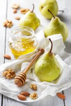 Pears with honey Stock Photos