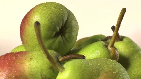 Pears isolated rotating on beige background Stock Footage 62408896