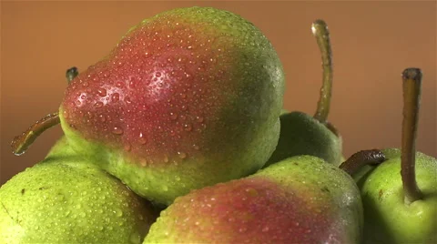 Pears isolated rotating on brown background Stock Footage 62407112