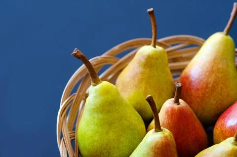 Pears. Pears harvest. Fruit background. Fresh organic pears in the basket. Pear Stock Photos