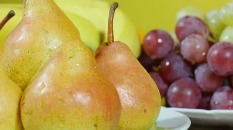 Pears on plate extreme close up,other fruits around on table,dolly shot Stock Footage 60725972