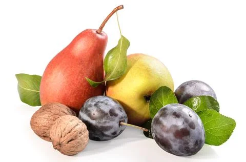 Pears, plums and walnuts on a white background with soft shadow Stock Photos