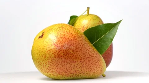 Pears rotating on white background Stock Footage 111954643