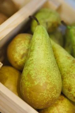 Pears on a rustic wooden kitchen table Stock Photos