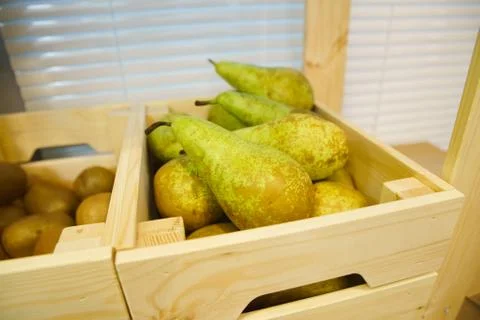 Pears on a rustic wooden kitchen table Stock Photos
