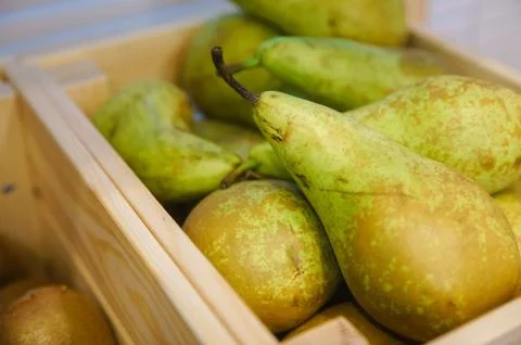 Pears on a rustic wooden kitchen table Stock Photos