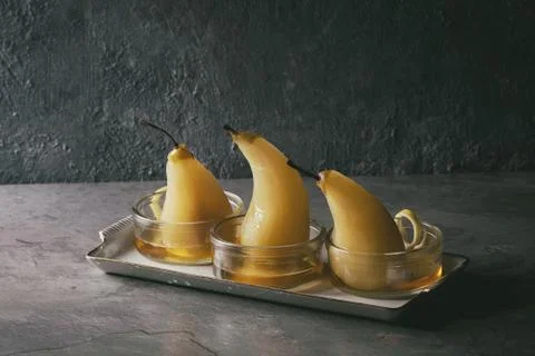 Pears in wine Stock Photos