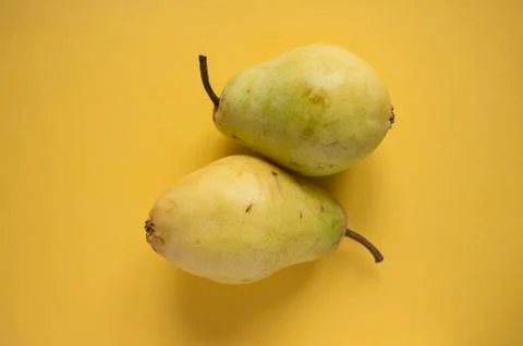Pears on yellow background Foto stock
