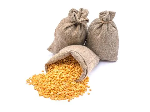 Peas in a bag, isolated on a white background.Split peas in burlap. Healthy f Stock Photos