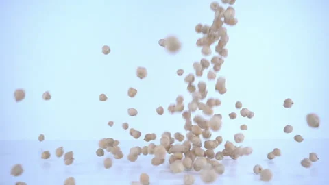 Peas falling in slow motion (10x speed). Stock Footage 95670445
